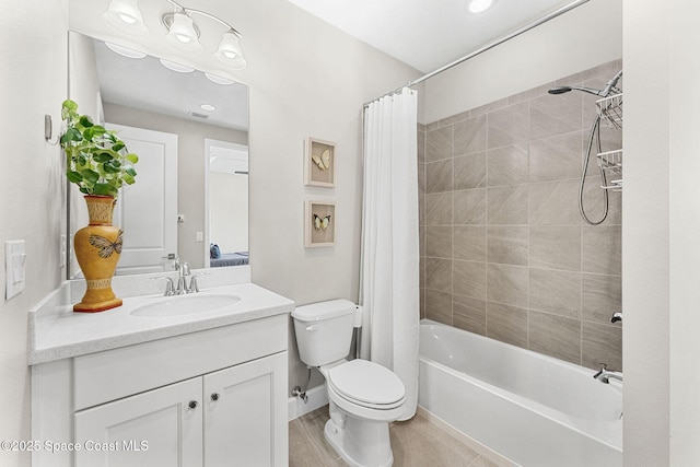 full bathroom featuring shower / bathtub combination with curtain, vanity, and toilet