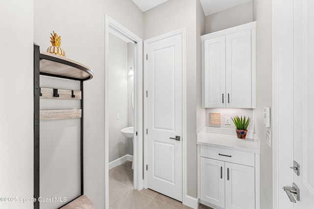 bathroom featuring tile patterned flooring