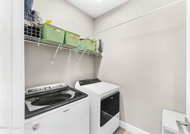 laundry room with independent washer and dryer