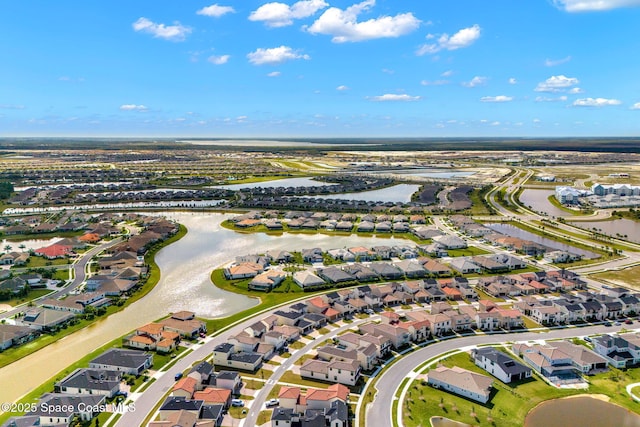 drone / aerial view with a water view