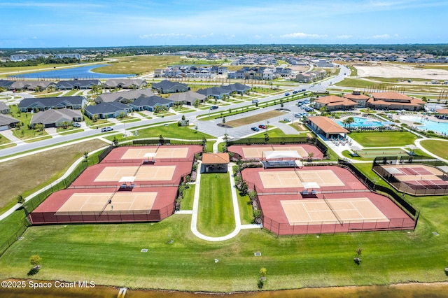 birds eye view of property with a water view