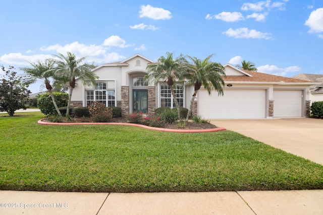 view of front of home with a garage and a front yard