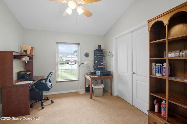 carpeted home office with ceiling fan and lofted ceiling