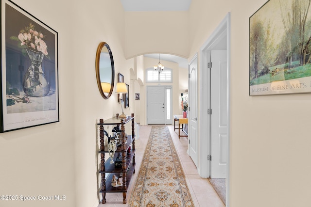 hall featuring light tile patterned flooring