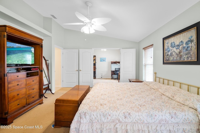 bedroom featuring lofted ceiling, light carpet, and ceiling fan