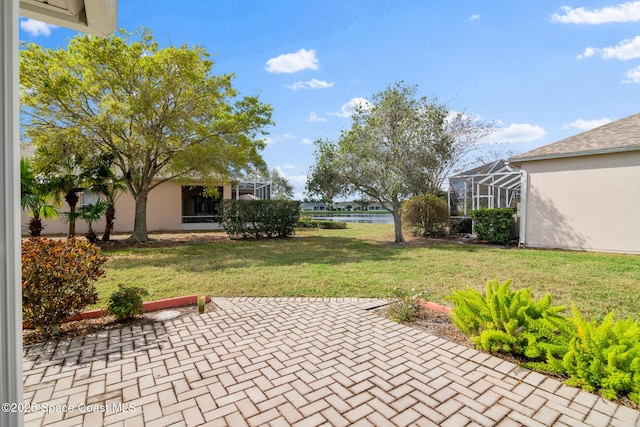 view of patio with a lanai