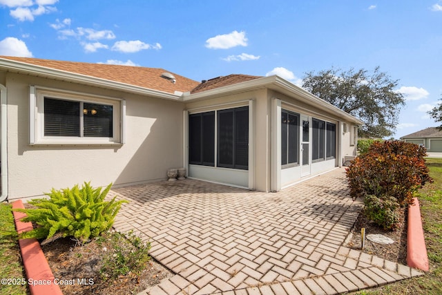 rear view of house featuring a patio area