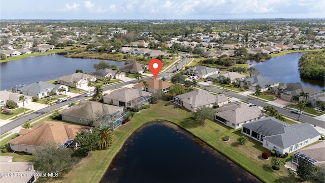 birds eye view of property featuring a water view