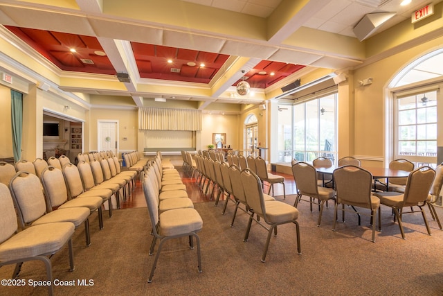 dining room with beamed ceiling and coffered ceiling