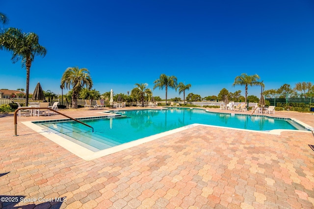 view of swimming pool with a patio area