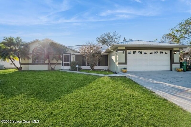 ranch-style house featuring a sunroom, metal roof, concrete driveway, and a front yard