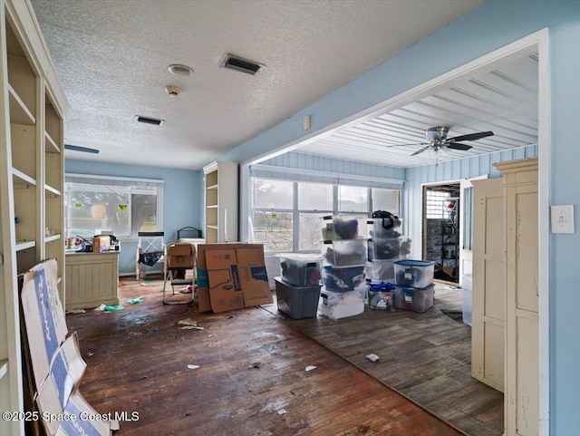 office space with hardwood / wood-style flooring, ceiling fan, and a textured ceiling