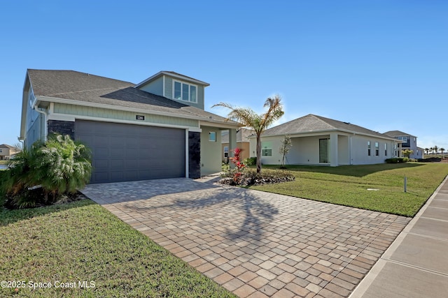 view of front facade with a garage and a front yard