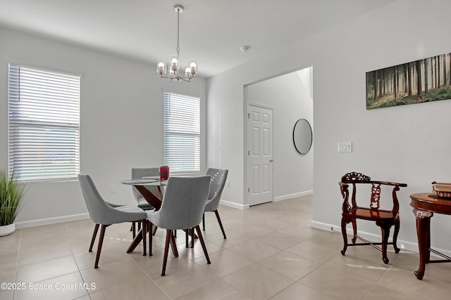 tiled dining room featuring a notable chandelier