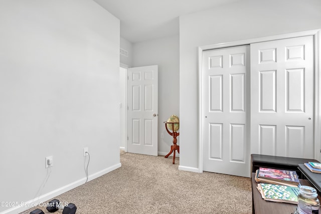 carpeted bedroom featuring a closet