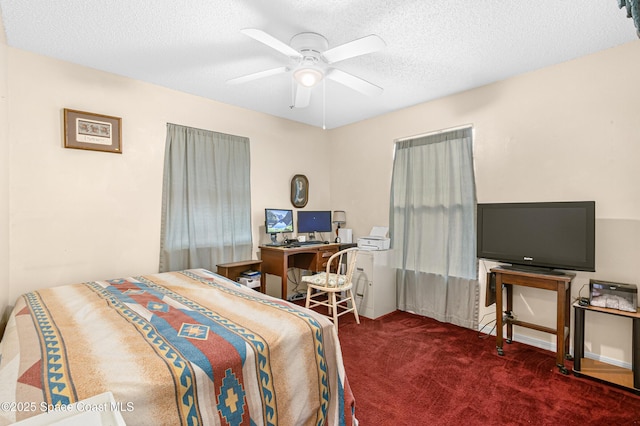 bedroom with dark colored carpet, ceiling fan, and a textured ceiling