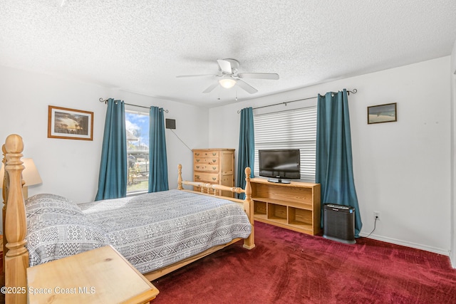 carpeted bedroom featuring a textured ceiling, ceiling fan, and baseboards