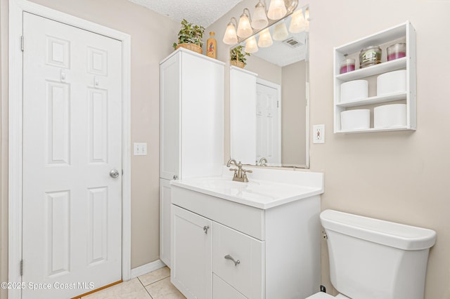 bathroom featuring visible vents, toilet, tile patterned flooring, a textured ceiling, and vanity