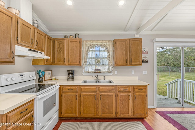 kitchen featuring crown molding, light countertops, white electric range, a sink, and under cabinet range hood