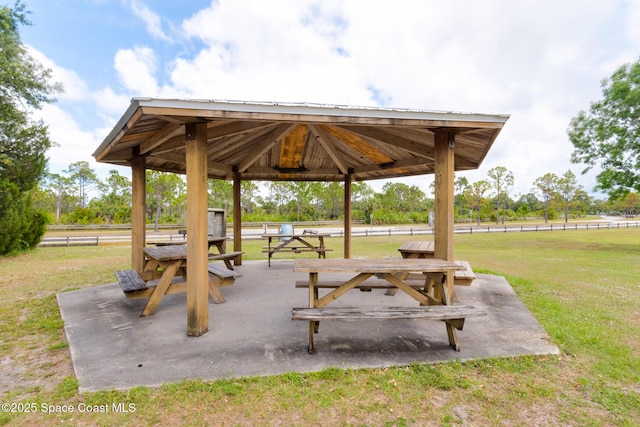 view of home's community with a gazebo, fence, and a yard