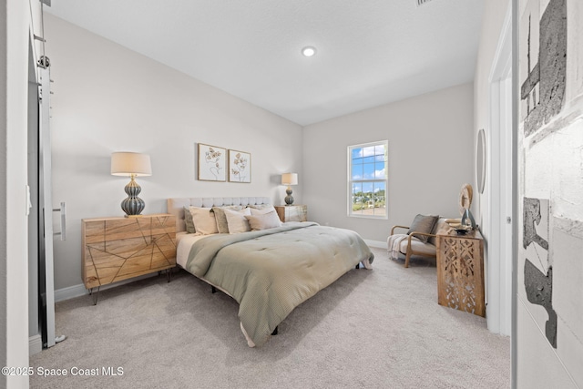 bedroom featuring light colored carpet