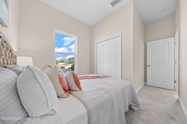 carpeted bedroom with a closet