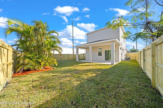 view of yard with cooling unit and a patio