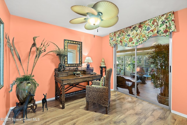 home office featuring hardwood / wood-style flooring and ceiling fan