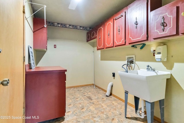 washroom with cabinets and hookup for a washing machine