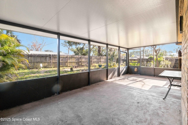 unfurnished sunroom featuring plenty of natural light