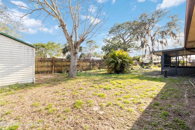 view of yard featuring a sunroom