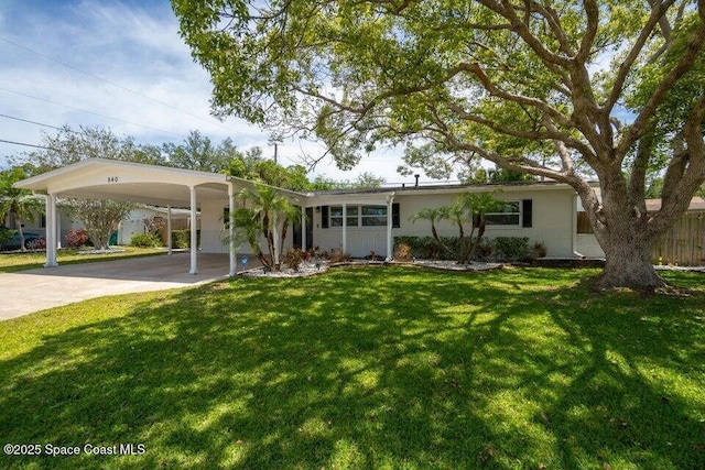 ranch-style home with a carport and a front lawn