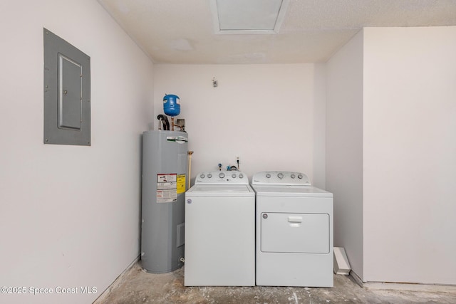 clothes washing area featuring laundry area, electric panel, water heater, and separate washer and dryer