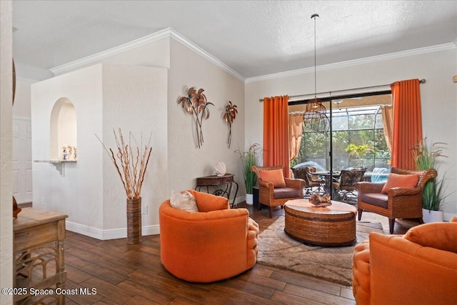 living room with ornamental molding, dark wood-type flooring, and a textured ceiling