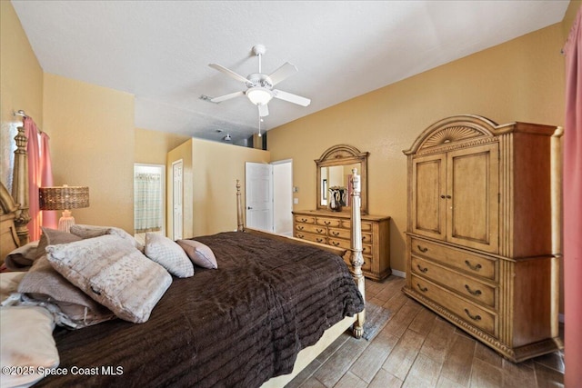 bedroom with dark wood-type flooring and ceiling fan