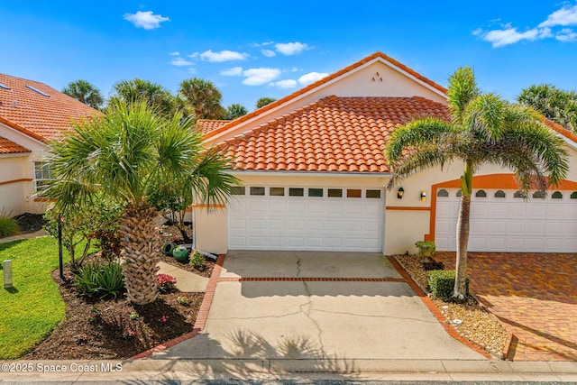 mediterranean / spanish-style house featuring a garage