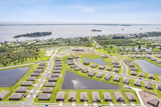 drone / aerial view featuring a water view