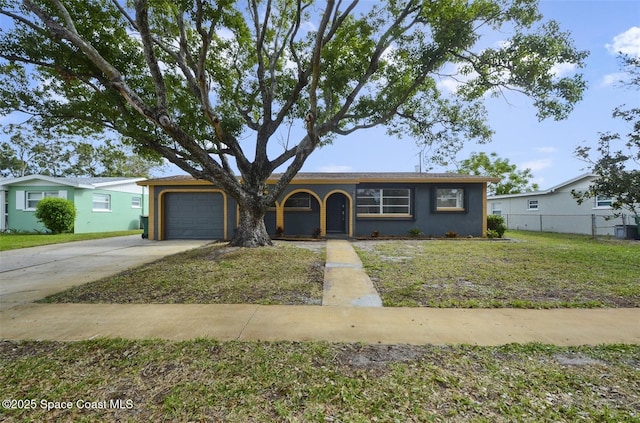 ranch-style house with a garage and a front yard