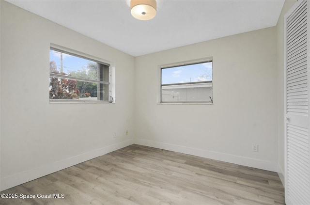 spare room featuring light hardwood / wood-style flooring