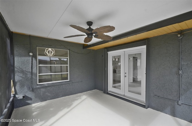 view of patio featuring ceiling fan and french doors