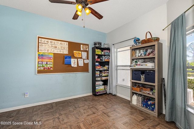 interior space featuring ceiling fan