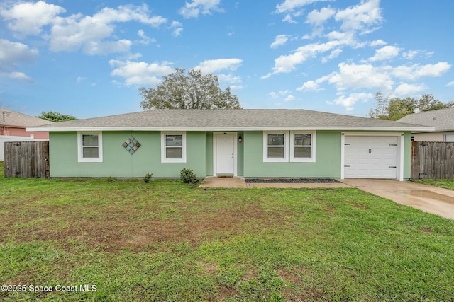 single story home featuring a garage and a front yard