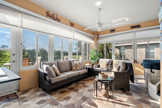 sunroom / solarium with ceiling fan