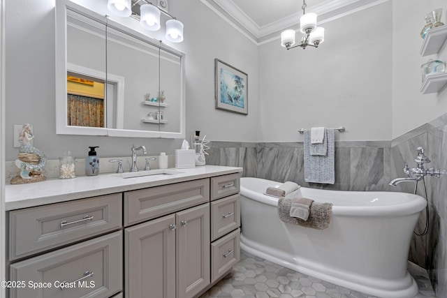 bathroom with crown molding, tile walls, vanity, a tub to relax in, and tile patterned floors