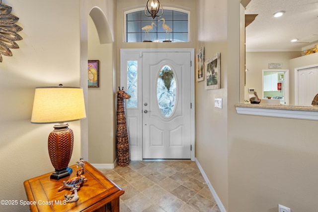 entrance foyer featuring ornamental molding