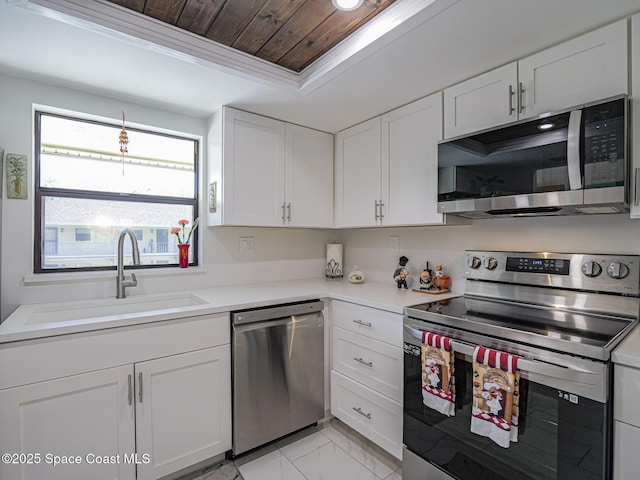 kitchen featuring white cabinetry, wood ceiling, appliances with stainless steel finishes, and sink