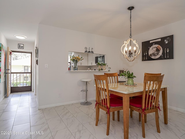 dining space featuring an inviting chandelier