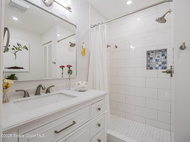 bathroom featuring vanity and walk in shower