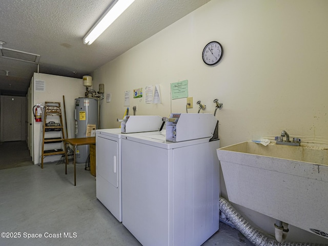 laundry room featuring sink, electric water heater, independent washer and dryer, and a textured ceiling