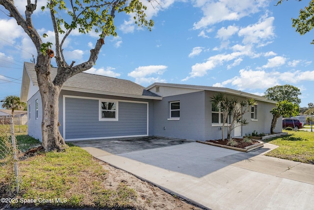 single story home with fence and driveway